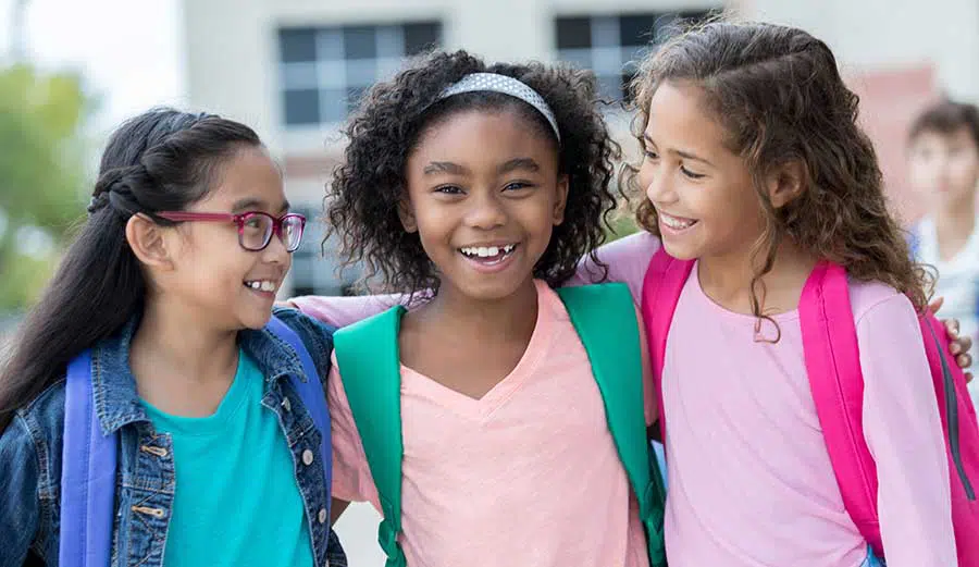 three girls smiling