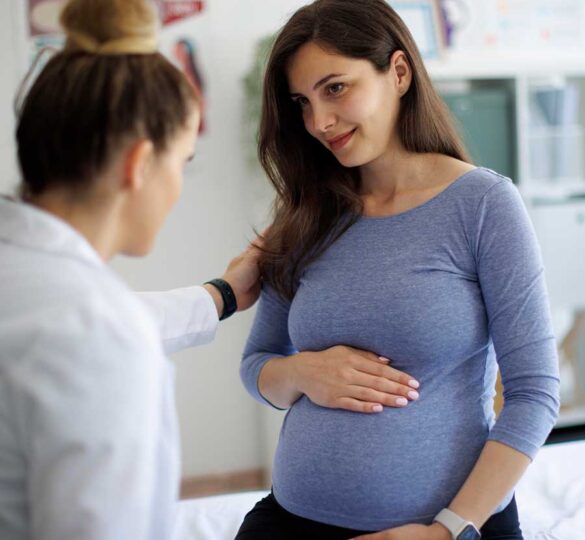 Pregnant woman with her doctor