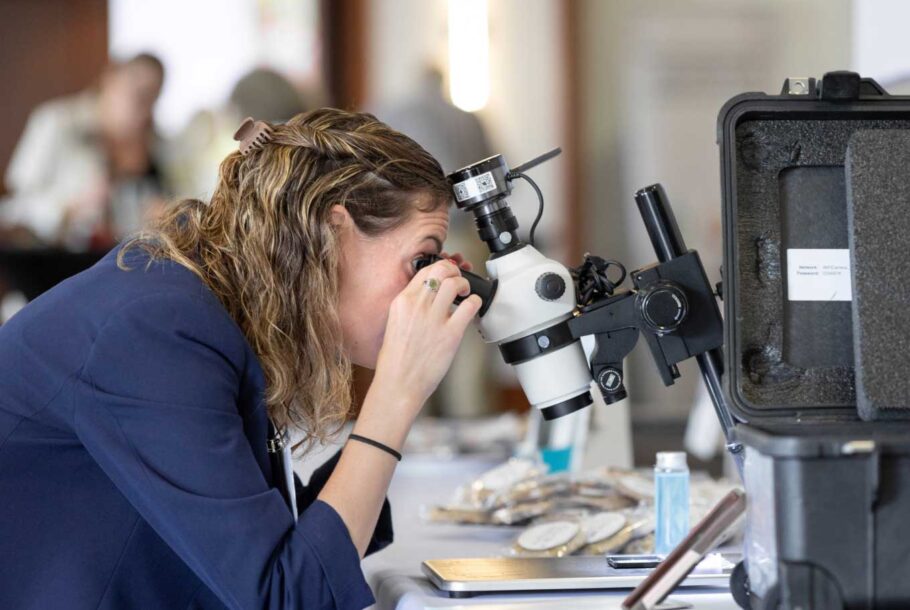 Woman Looking Through Microscope